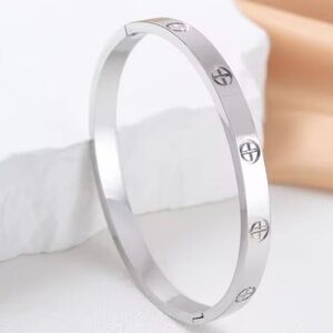 Silver love inspired Bangle Bracelet. Measure 6 in around wrist.